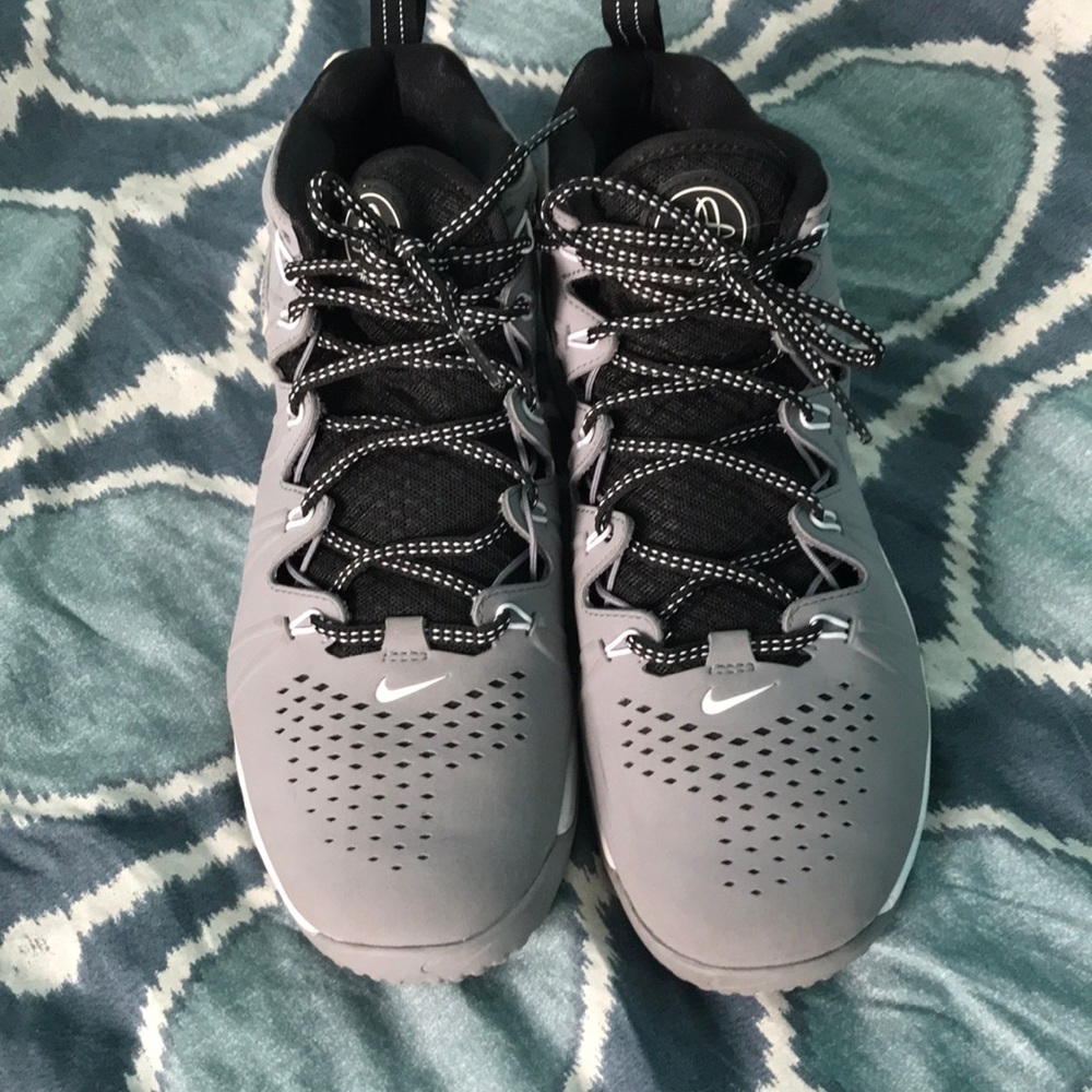 Nike Lacrosse Indoor cleats. Neutral enough that would work for a girl, too